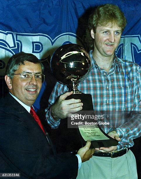 Boston Celtics player Larry Bird, right, and NBA commissioner David Stern pose with the trophy for most valuable player of the NBA Finals on June 11,...