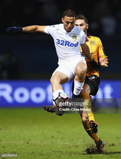 Kemar Roofe of Leeds United controls the ball from Greg Taylor of Cambridge United during the Emirates FA Cup Third Round match between Cambridge...