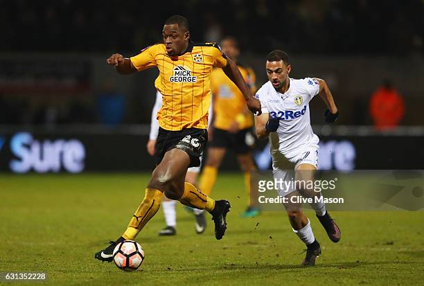 Uche Ikpeazu of Cambridge United is chased by Kemar Roofe of Leeds United during the Emirates FA Cup Third Round match between Cambridge United and...