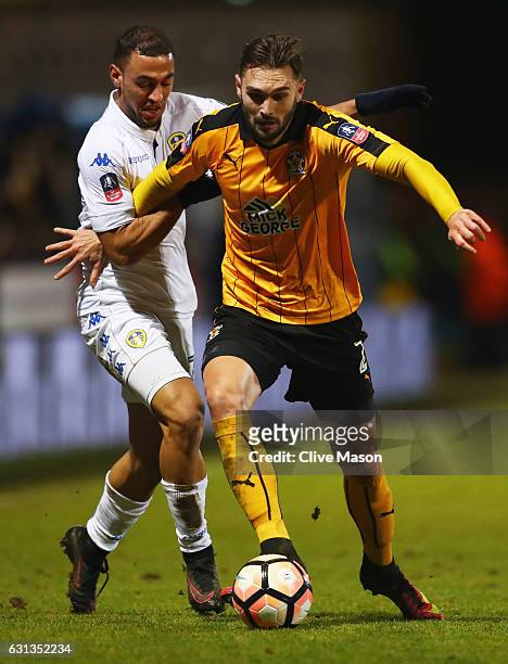 Kemar Roofe of Leeds United battles with Greg Taylor of Cambridge United during the Emirates FA Cup Third Round match between Cambridge United and...