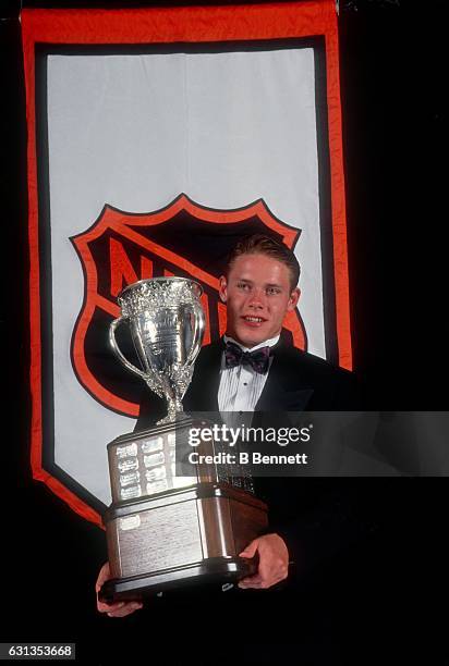 Pavel Bure of the Vancouver Canucks poses after winning the Calder Trophy named for the top rookie of the year.