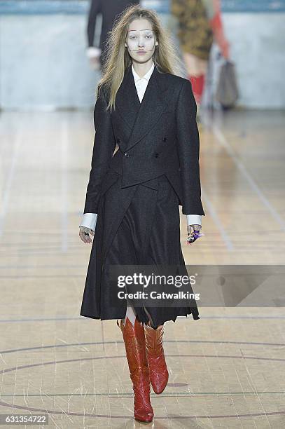 Model walks the runway at the Vivienne Westwood Autumn Winter 2017 fashion show during London Menswear Fashion Week on January 9, 2017 in London,...