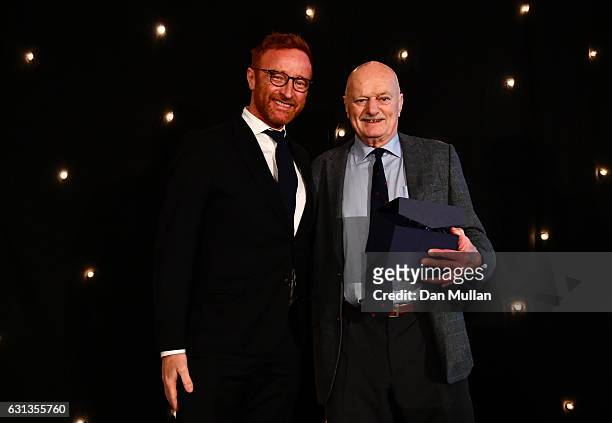 Ben Ryan presents Des Seabrook with the Rugby Union Writers' Club Tankard Award during the Rugby Union Writers' Club Annual Dinner & Awards at the...