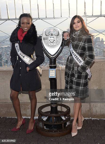Miss USA Deshauna Barber and Miss Universe Pia Wurtzbach visit the Empire State Building on January 9, 2017 in New York City.