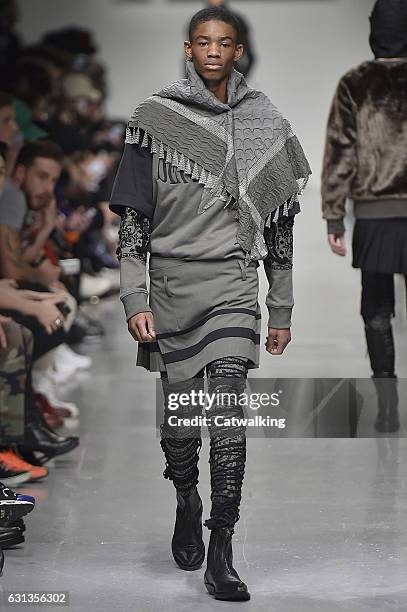 Model walks the runway at the KTZ Autumn Winter 2017 fashion show during London Menswear Fashion Week on January 8, 2017 in London, United Kingdom.