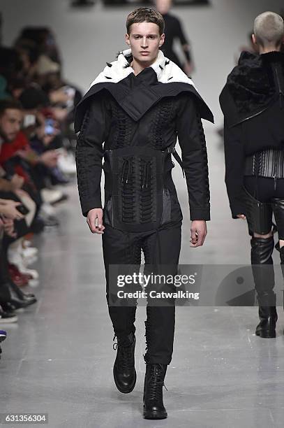 Model walks the runway at the KTZ Autumn Winter 2017 fashion show during London Menswear Fashion Week on January 8, 2017 in London, United Kingdom.