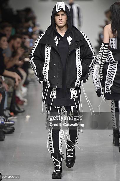 Model walks the runway at the KTZ Autumn Winter 2017 fashion show during London Menswear Fashion Week on January 8, 2017 in London, United Kingdom.