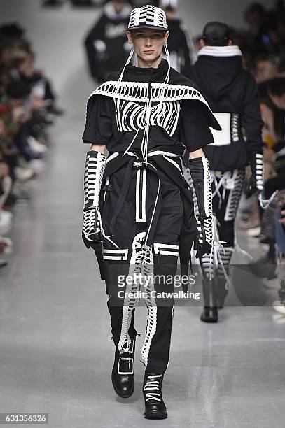 Model walks the runway at the KTZ Autumn Winter 2017 fashion show during London Menswear Fashion Week on January 8, 2017 in London, United Kingdom.