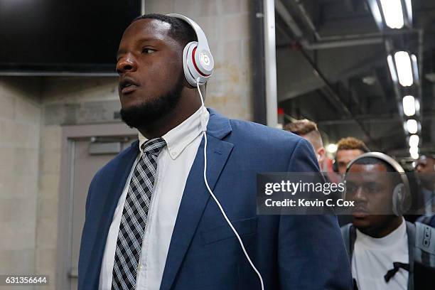 Offensive lineman Cam Robinson of the Alabama Crimson Tide arrives before taking on the Clemson Tigers in the 2017 College Football Playoff National...