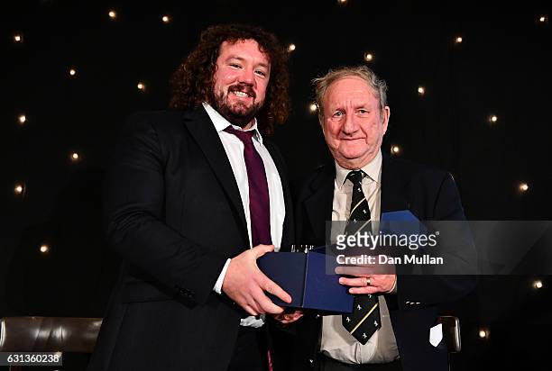 Adam Jones of Wales and Harlequins presents Bryan James with the Rugby Union Writers' Club Tankard Award during the Rugby Union Writers' Club Annual...