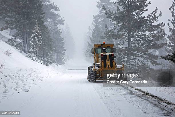 Snowplow removes freshly fallen snow along Donner Pass Road, in Soda Springs, Calif., on Jan. 9, 2017. A roaring 'Pineapple Express' weather system...