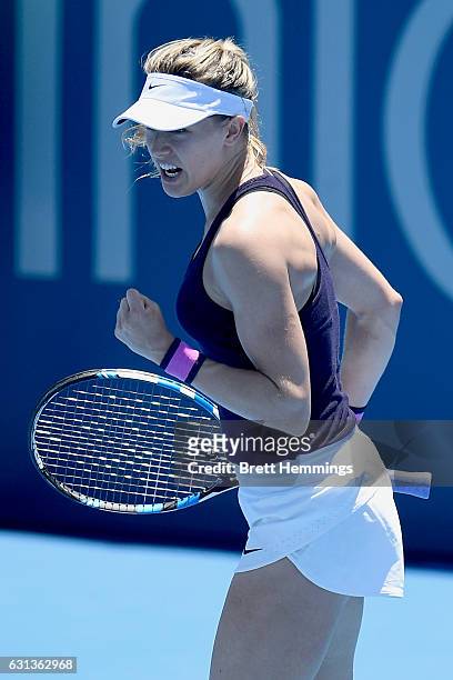 Eugenie Bouchard of Canada celebrates winning the first set in her second round match against Dominika Cibulkova of Slovakia during day three of the...