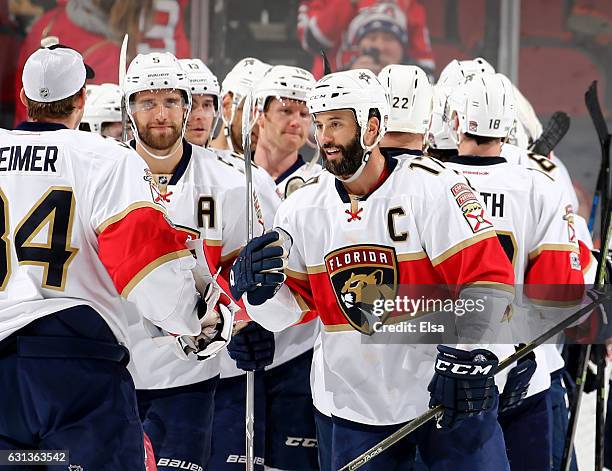 Derek MacKenzie of the Florida Panthers and the rest of the team celebrates the win over the New Jersey Devils on January 9, 2017 at Prudential...