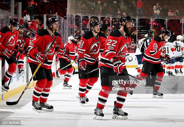 Kyle Quincey of the New Jersey Devils and the rest of the team head to the locker room after the loss to the Florida Panthers on January 9, 2017 at...