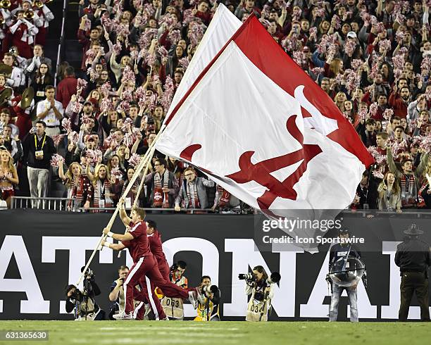 Alabama cheerleaders storm the field after a touchdown during the first half of the CFP National Championship game between the Alabama Crimson Tide...