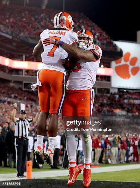 Wide receiver Mike Williams of the Clemson Tigers celebrates with tight end Jordan Leggett after scoring a 4-yard touchdown during the fourth quarter...