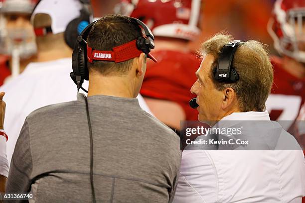 Head coach Nick Saban and offensive coordinator Steve Sarkisian of the Alabama Crimson Tide talk on the sideline during the second half of the 2017...