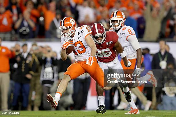 Wide receiver Hunter Renfrow of the Clemson Tigers runs after catching a 24-yard touchdown pass during the third quarter against the Alabama Crimson...
