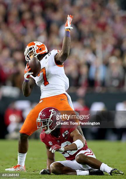 Wide receiver Mike Williams of the Clemson Tigers reacts after making a reception against defensive back Marlon Humphrey of the Alabama Crimson Tide...