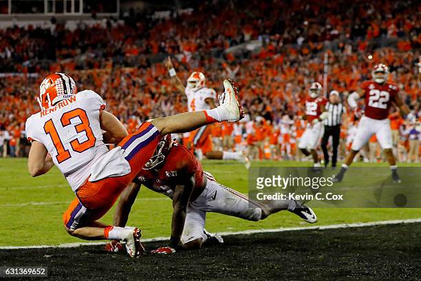 Wide receiver Hunter Renfrow of the Clemson Tigers makes a 2-yard game-winning touchdown reception against defensive back Tony Brown of the Alabama...