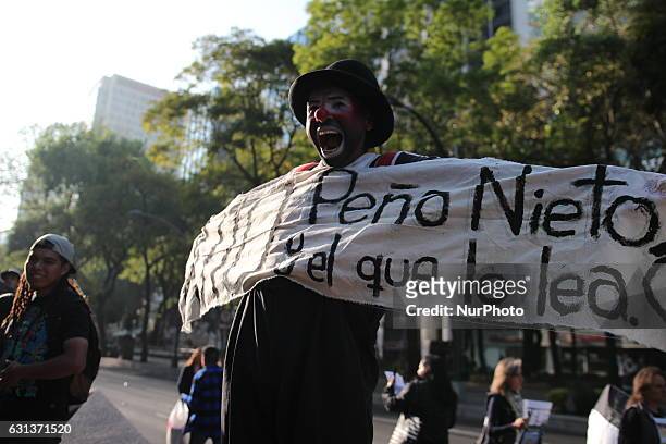 Man dressed a a clown protest against fuel prices in Mexico City, on 9 January 2017. Largely peaceful protests against the fuel price increases...