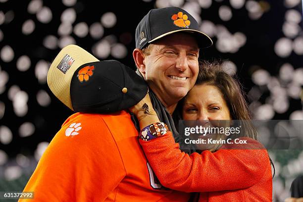 Head coach Dabo Swinney of the Clemson Tigers celebrates with his wife, Kathleen Swinney, after defeating the Alabama Crimson Tide 35-31 to win the...