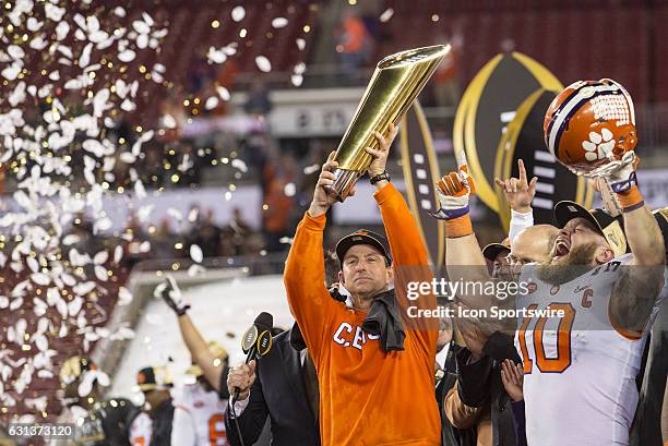 Clemson Tigers head coach Dabo Swinney and Clemson Tigers linebacker Ben Boulware celebrate the win after the College Football Playoff National...