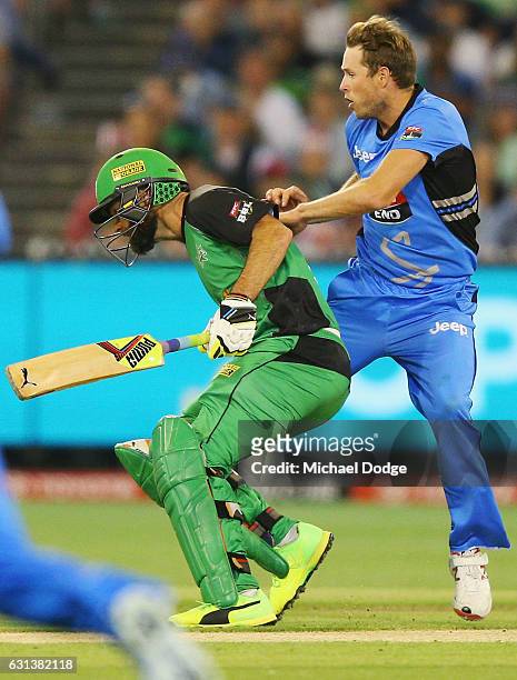 Rob Quiney of the Stars and Ben Laughlin of the Strikers get caught up in the wicket during the Big Bash League match between the Melbourne Stars and...