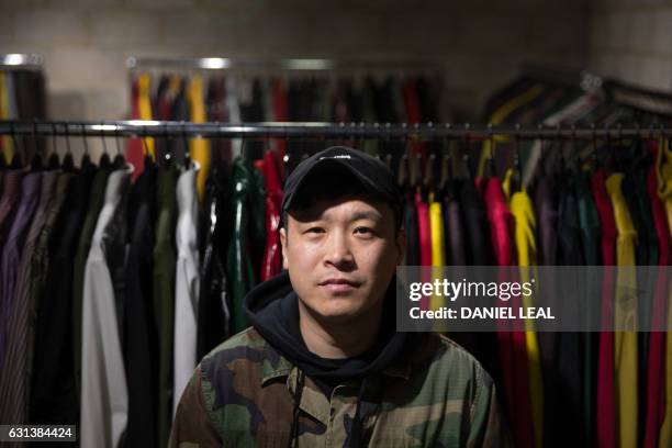 Japanese fashion designer and former boxer Arashi Yanagawa poses for a picture at a fashion studio in east London on January 6, 2017. - After making...