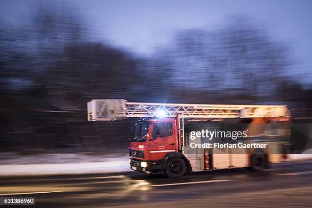 Truck of the fire brigade with emergency lights on are pictured on January 09, 2017 in Goerlitz, Germany.