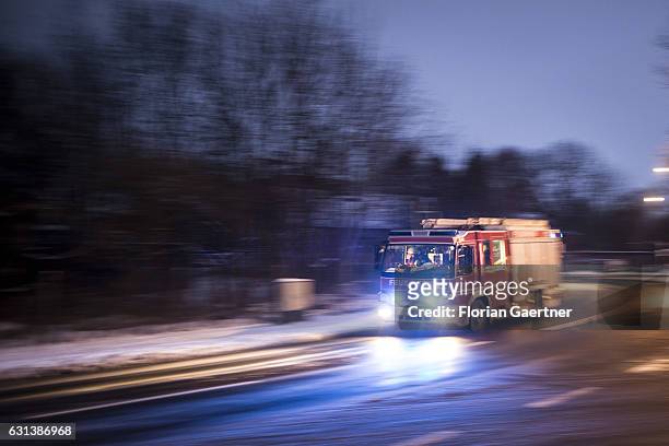 Truck of the fire brigade with emergency lights on are pictured on January 09, 2017 in Goerlitz, Germany.
