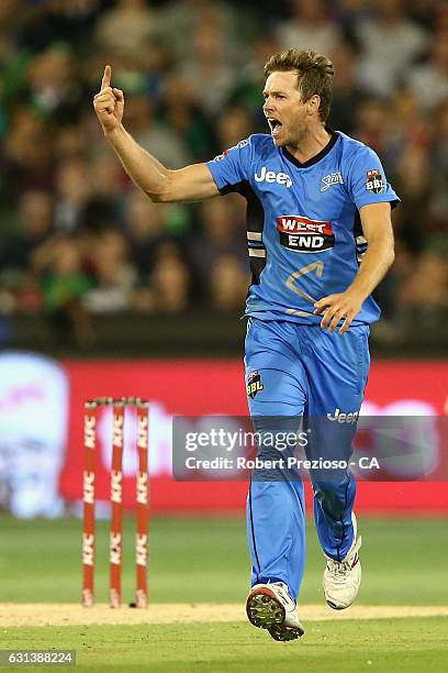 Ben Laughlin of the Strikers celebrates the wicket of Evan Gulbis of the Stars during the Big Bash League match between the Melbourne Stars and the...