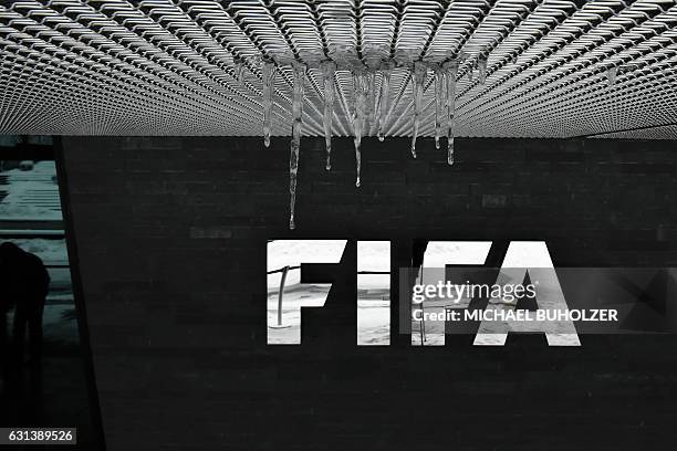 The logo of the International Federation of Association Football with hanging icicles is pictured at the FIFA headquarters in Zurich, during meeting...