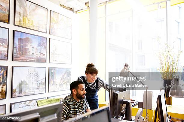 creative colleagues discussing a project. - authentic photo office stock-fotos und bilder