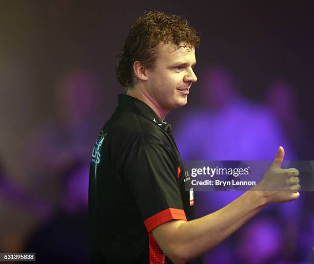 Richard Veenstra of The Netherlands reacts during his first round match on day four of the BDO Lakeside World Professional Darts Championships on...