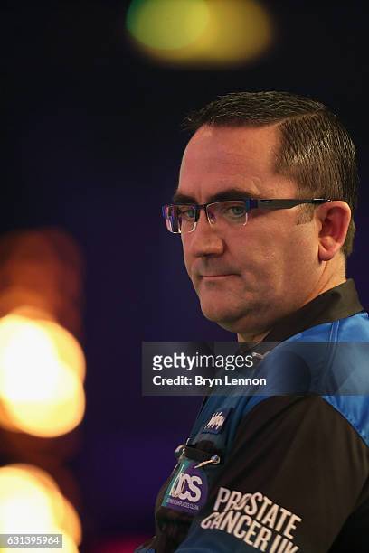 Ross Montgomery of Great Britain reacts during his first round match on day four of the BDO Lakeside World Professional Darts Championships on...