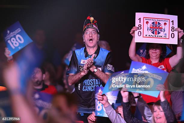 Members of the crowd react to a "180" during the first round match on day four of the BDO Lakeside World Professional Darts Championships on January...