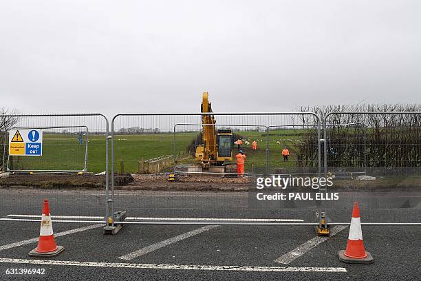 Workers contruct an access road at the Preston New Road site where Energy firm Cuadrilla are setting up fracking operations at Little Plumpton near...