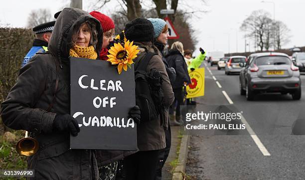 Protesters hold placards at the Preston New Road site where Energy firm Cuadrilla are setting up fracking operations at Little Plumpton near...