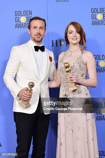Actor Ryan Gosling and actress Emma Stone pose in the press room during the 74th Annual Golden Globe Awards at The Beverly Hilton Hotel on January 8,...