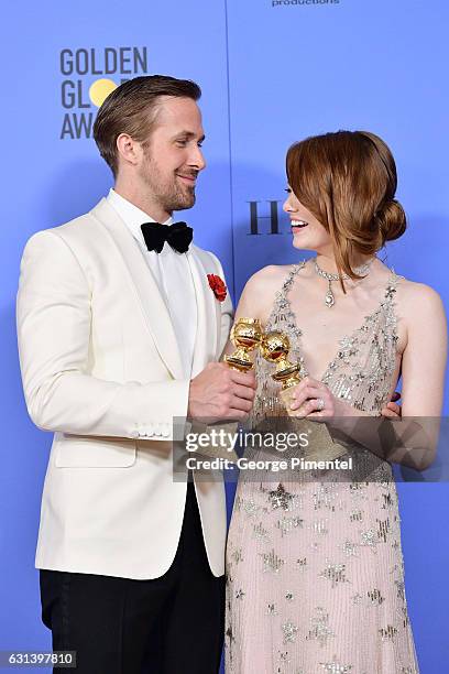 Actor Ryan Gosling and actress Emma Stone pose in the press room during the 74th Annual Golden Globe Awards at The Beverly Hilton Hotel on January 8,...