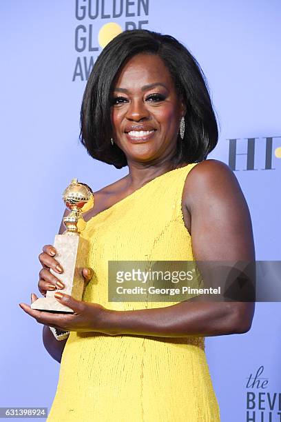 Actress Viola Davis, winner of the Best Performance by an Actress in a Supporting Role in Any Motion Picture for 'Fences', poses in the press room...