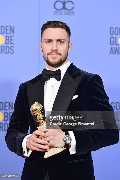 Actor Aaron Taylor-Johnson, winner of the Best Performance by an Actor in a Supporting Role in a Motion Picture award for 'Nocturnal Animals,' poses...