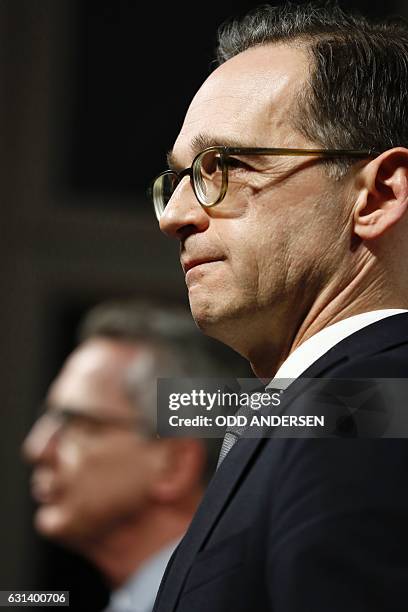 German Interior Minister Thomas de Maiziere and German Justice Minister Heiko Maas attend a press conference on security reforms after the Berlin...