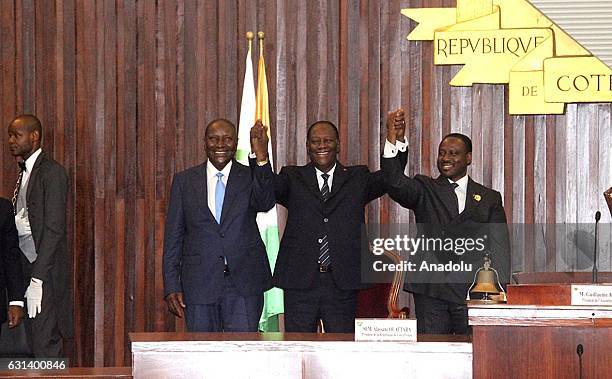 Ivory Coast's President Alassane Ouattara , Former Prime Minister Daniel Kablan Duncan and Parliament Speaker Soro Guillaume greet the lawmakers...