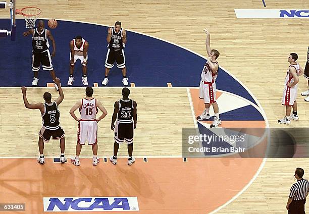 The Georgia State Panthers celebrate as Mark Vershaw of the Wisconsin Badgers fails to make the first of two missed free throws in the last minute of...