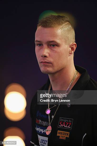 Wesley Harms of The Netherlands looks on during his first round match on day four of the BDO Lakeside World Professional Darts Championships on...