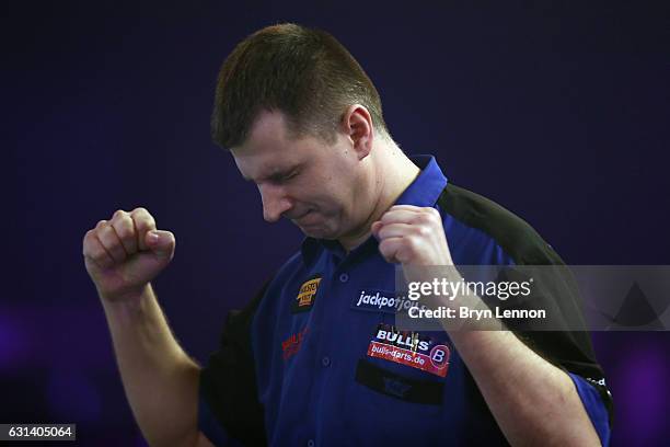 Krzysztof Ratajski of Poland reacts to winning his first round match on day four of the BDO Lakeside World Professional Darts Championships on...