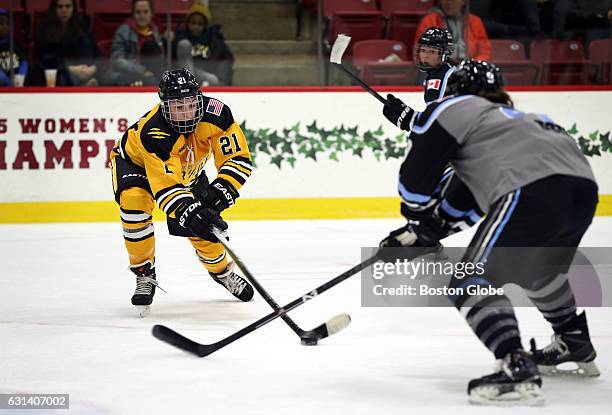 Boston's, Hilary Knight, reaches for the puck during the Boston Pride women's pro hockey team game against the Buffalo Beauts at Harvard's...