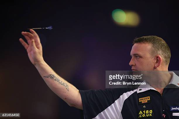 Mark McGeeney of Great Britain reacts during his first round match on day four of the BDO Lakeside World Professional Darts Championships on January...